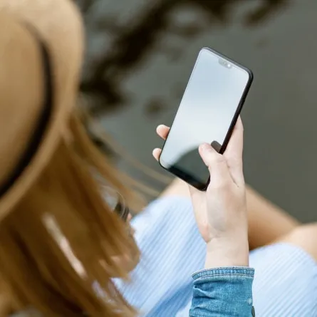 a woman using her smartphone outside